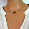 N3258bisf_collier_fleur_acier_inoxydable_plaque_or