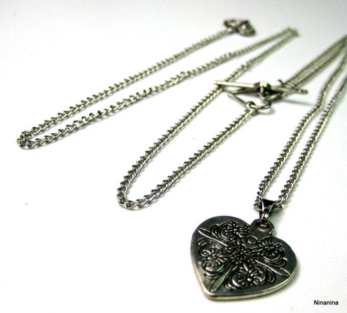 N3366tere_collier_de_dos_coeur_metal_argent