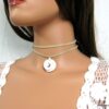 N4350s_collier_cordon_daim_et_coquillage_escargot_blanc-1
