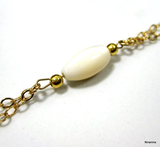 N2558terg bijou de pied plaqué or et nacre