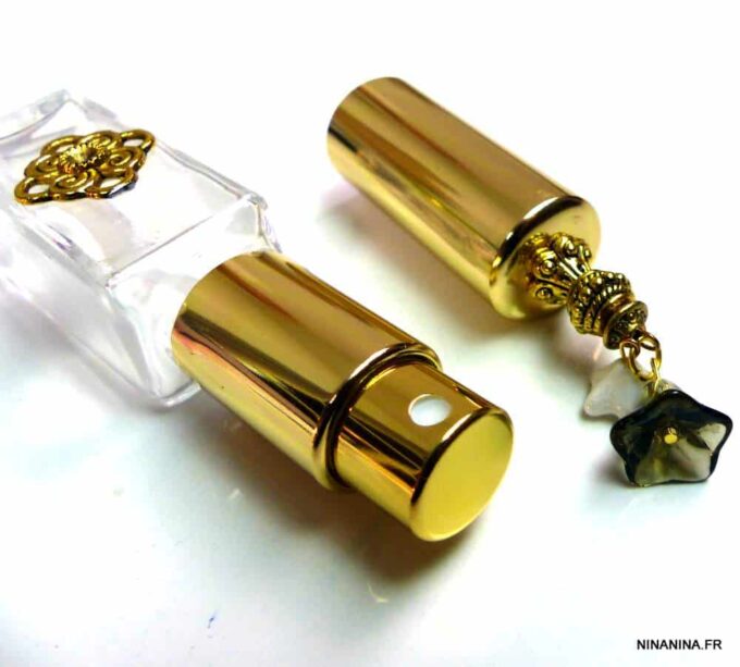 N303terj vaporisateur de sac verre et métal doré