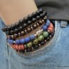 N5675h Bracelet elastique mala homme perles bois marron rondelles métal noir - Bijoux Bracelets en ligne Ninanina