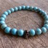 N5678 Bracelet homme stretch elastique perles turquoises blanches tete de mort métal noir NINANINA