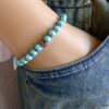 N5678g Bracelet homme stretch elastique perles turquoises blanches tete de mort métal noir NINANINA