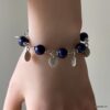 N569g Bracelet perles Lapis Lazuli femme breloques argentées - Bijoux Bracelets en ligne Ninanina