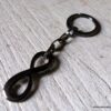 N5708a Porte-clé symbole infini et chaine métal noir - Accessoires Porte clés en ligne Ninanina