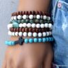 N6028 Bracelet perles turquoises naturelles croix noire - Bijoux Bracelets en ligne Ninanina