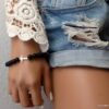 N6178c Bracelet strech perles onyx noir croix argent 925 massif - Bijoux Bracelets en ligne Ninanina
