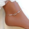 N6551 Chaine cheville swarovski perles blanches symbole infini argent - Bijoux Chaines en ligne Ninanina