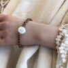 N6866b Bracelet oeil de ste lucie femme perles de bois 6mm - Bijoux Bracelets en ligne Ninanina
