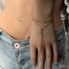 N7580c Bracelet avec bague reliée chaine fantaisie laiton doré - Bijoux Bracelets en ligne Ninanina