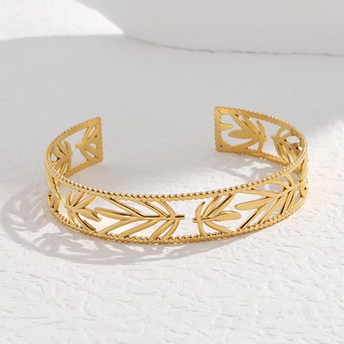 N7714e Bracelet manchette ajouré acier doré femme 12mm - Bijoux Bracelets en ligne Ninanina
